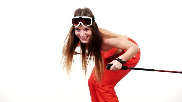 Woman skier preparing for season. Young girl with skiing gear bending squat down. Winter sport activity, healthy leisure relax concept. Joyful sportswoman isolated on white, studio shot, full HD.