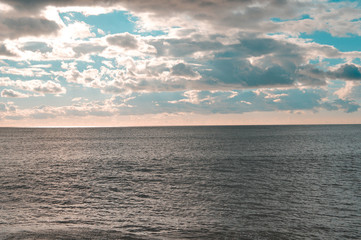 Naklejka na ściany i meble Amazing sunset beach blurry natural cloudy sky outdoors background