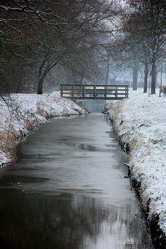 Frozen ditch in a winter scenery
