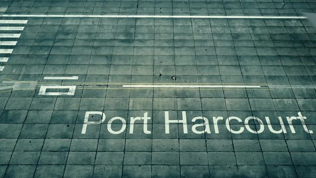 Aerial view of big airplane arriving to Port Harcourt airport. Travel to Nigeria conceptual intro animation