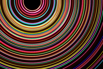 Round neon colorful lines background.