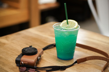 camera and lime drink