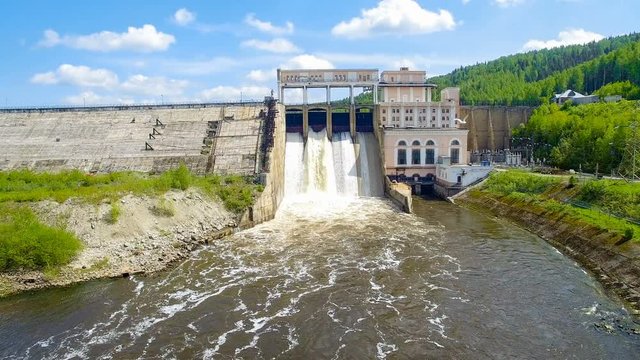 Rapid flight of  drone to old hydroelectric power station and dam