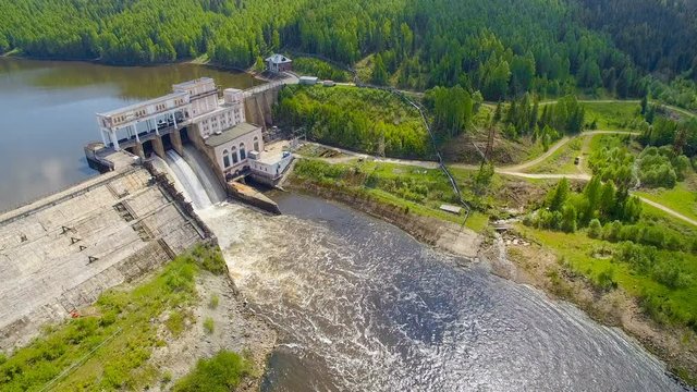 copter aerial view of hydroelectric power station in summer day
