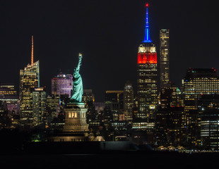 Statue of Liberty and Empire State shot in American colors.