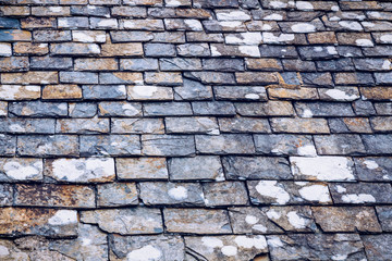 Background of old stone roof tiles