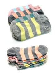 set of several multi colored socks isolated on white background