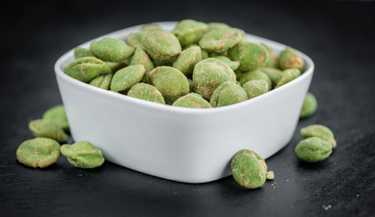 Portion of Wasabi coated Peanuts (selective focus)