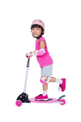 Asian little Chinese girl playing with scooter