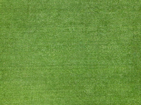 Green football field fake grass texture background