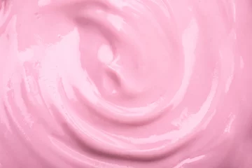 Dekokissen close up the pink creamy homemade blueberries or strawberries yogurt texture background © Cozine