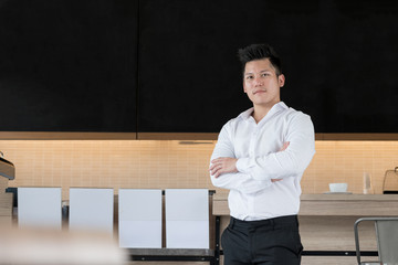 portrait of asian young male cafe owner