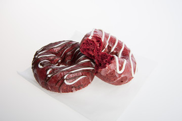 donut or donut with missing bite on a background.