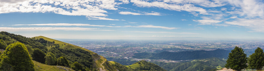 Fototapeta premium Great landscape on the Padana plain in summer time. Panorama from Linzone Mountain, Bergamo, Italy. 