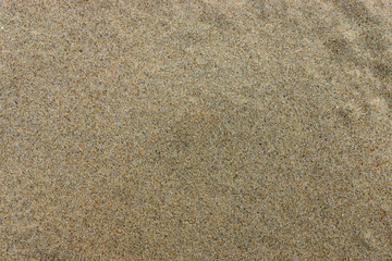 Fototapeta na wymiar closeup of sand pattern on beach in the summer.