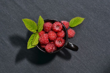 Raspberries in a mug