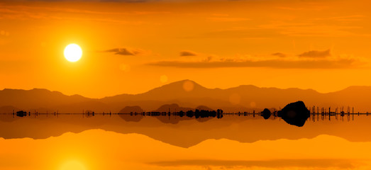 Silhouette of a mountain at the lake