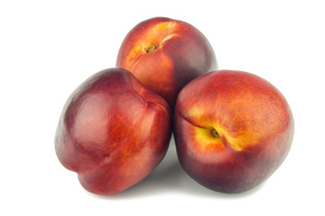 Fototapeta na wymiar Tasty ripe peaches isolated on white background