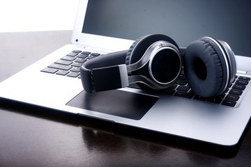 Headphones on a laptop computer.