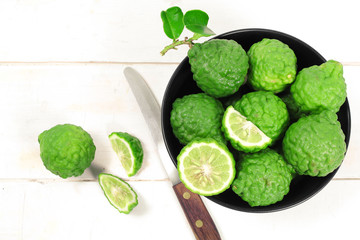Kaffir lime and kaffir lime leaf on white background