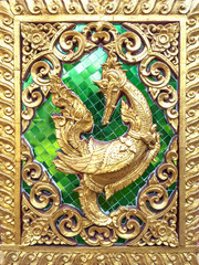 Stucco pattern of gold swan