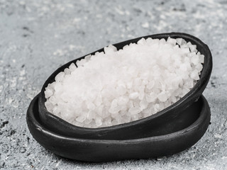 coarse sea salt on dark background close up