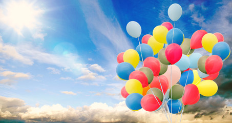Happiness, summer, wedding, birthday, honeymoon party: Multicolor ballons, blue sky, clouds and sun...