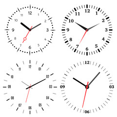 A set of four mechanical clocks. Clock face on white background.
