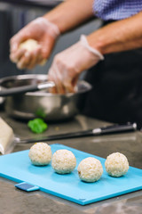 chef making arancini