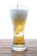 beer in a glass on white background