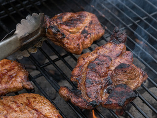 Delicious Grilled pork steak on the grill