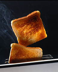 Two slices of toast in a Toaster - obrazy, fototapety, plakaty