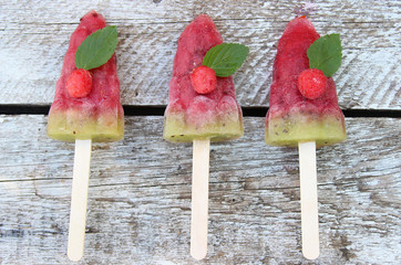 fruit ice. Fruit ice cream on a wooden background.
