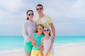 Young family on vacation on the beach. Family travel concept