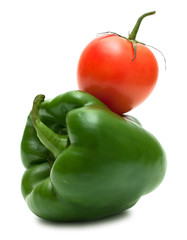 Ideal pair  green bell pepper and tomato isolated on white