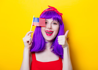 girl with purple color hair holding USA flag