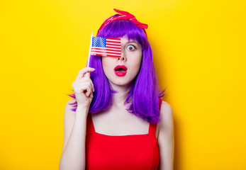 girl with purple color hair holding USA flag