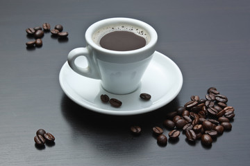 pile of coffee beans and a cup
