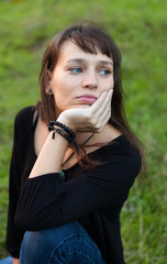 Fototapeta premium Beautiful brunette woman in the park