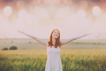 Fototapeta premium young woman on the wonderful wheat field background