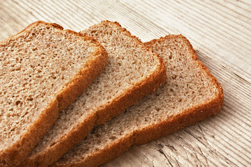 slices of rye bread on a wooden table