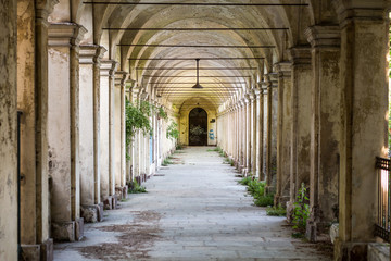 Fototapeta na wymiar Degraded portico in the former mental hospital of Collegno, Torino, Italy