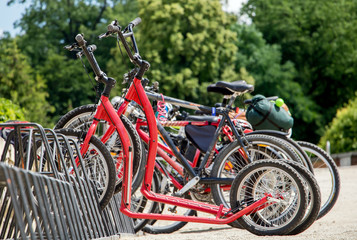 Fototapeta na wymiar scooters and bicycles stand in stand in the way