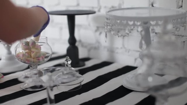 Cook Decorates a Table For a Children's Holiday. Pours Marshmallow