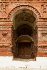 Wooden Door With Old Brick Arch Of Old Temple Of Nativity Of Christ In Village Gololobovo, Moscow Region.