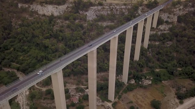 descending and tilting up alongside Modica viaduct