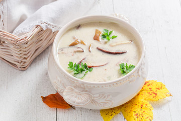 Delicious boletus cream on old white table