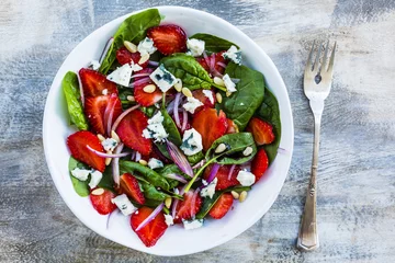 Zelfklevend Fotobehang Delicious and healthy strawberry salad and spinach with blue cheese.  © iMarzi