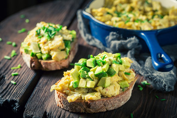 Closeup of fried eggs with chive and avocado
