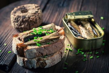 Healthy sandwich with sardines, chive and wholegrain bread